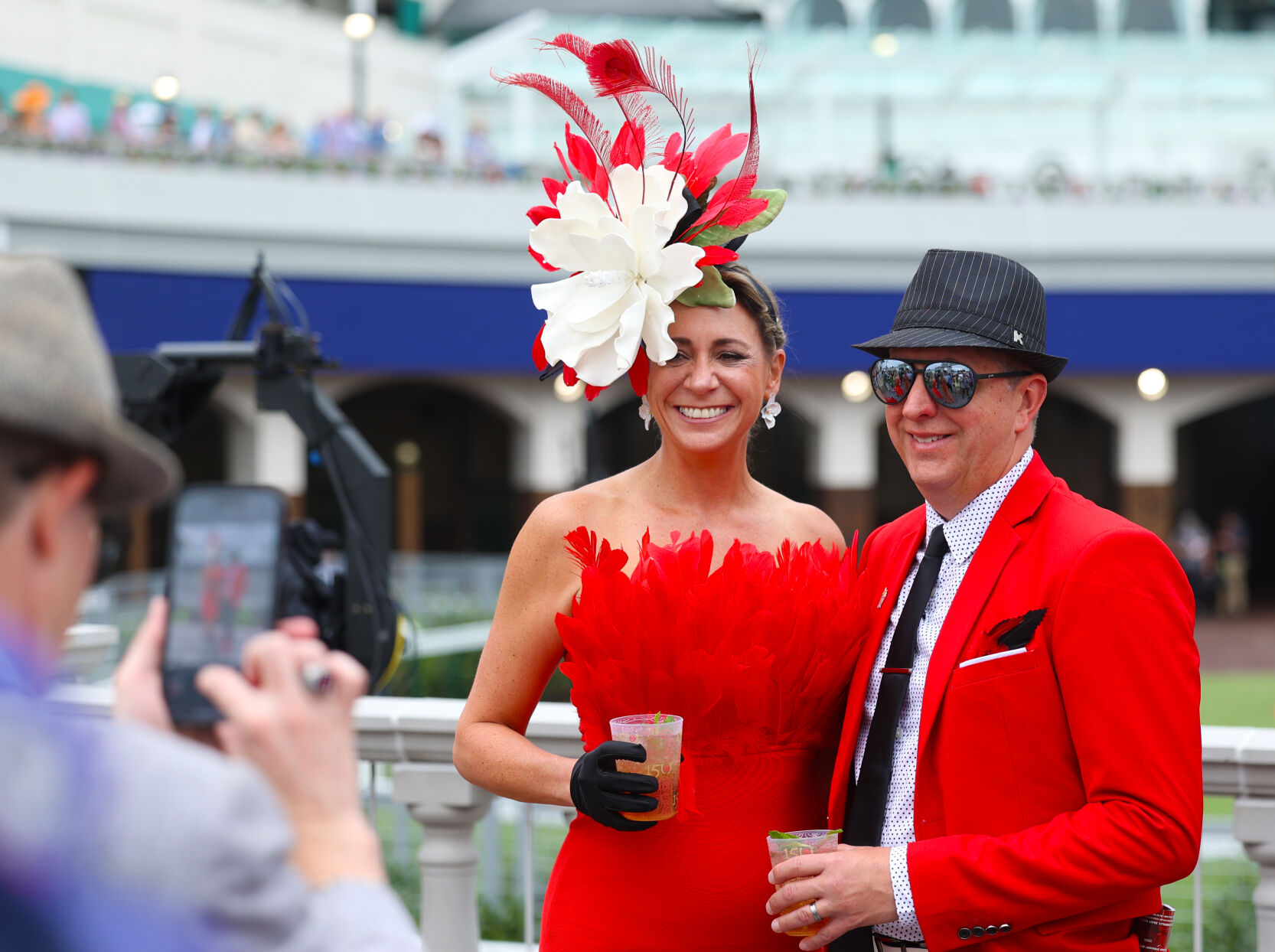 2 people take photo behind Twin Spires.JPG